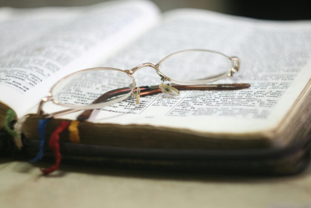 Open Bible glasses 