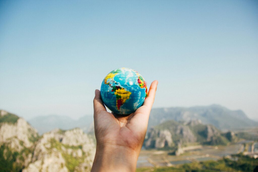 hand holding world globe