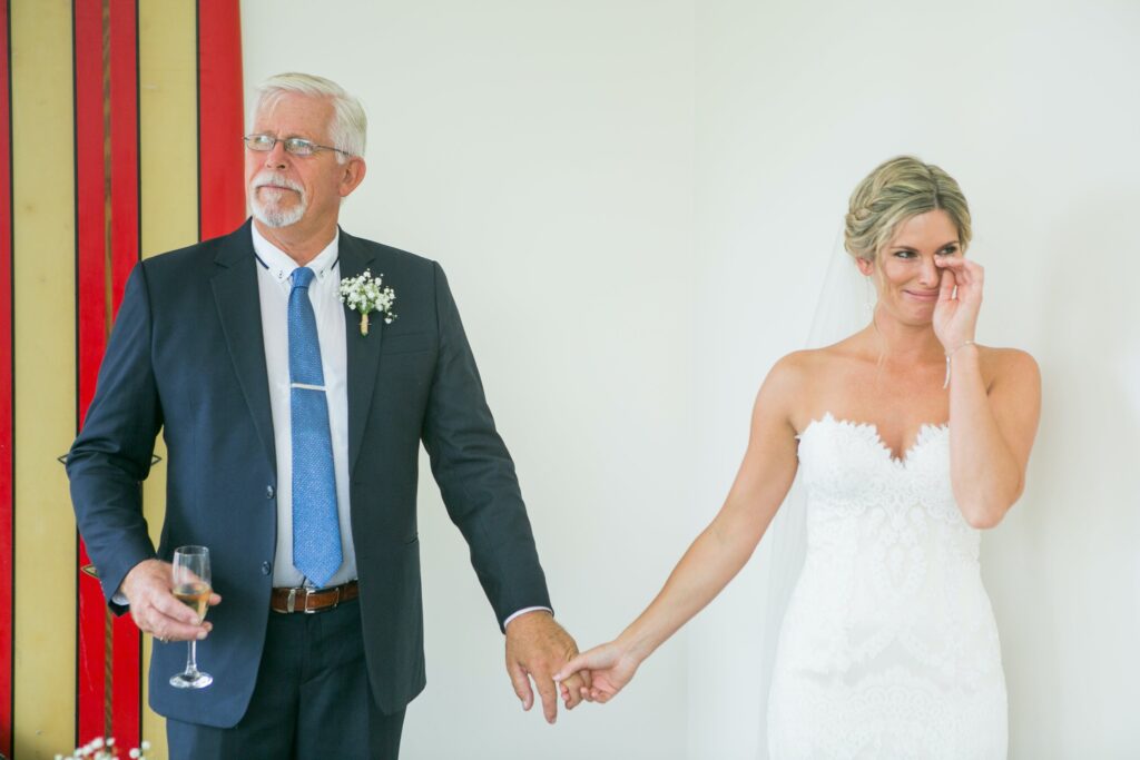 father giving away his daughter at wedding